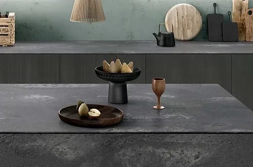 Caesarstone Rugged Concrete quartz countertop with a beautiful vase of flowers, highlighting stain resistance.
